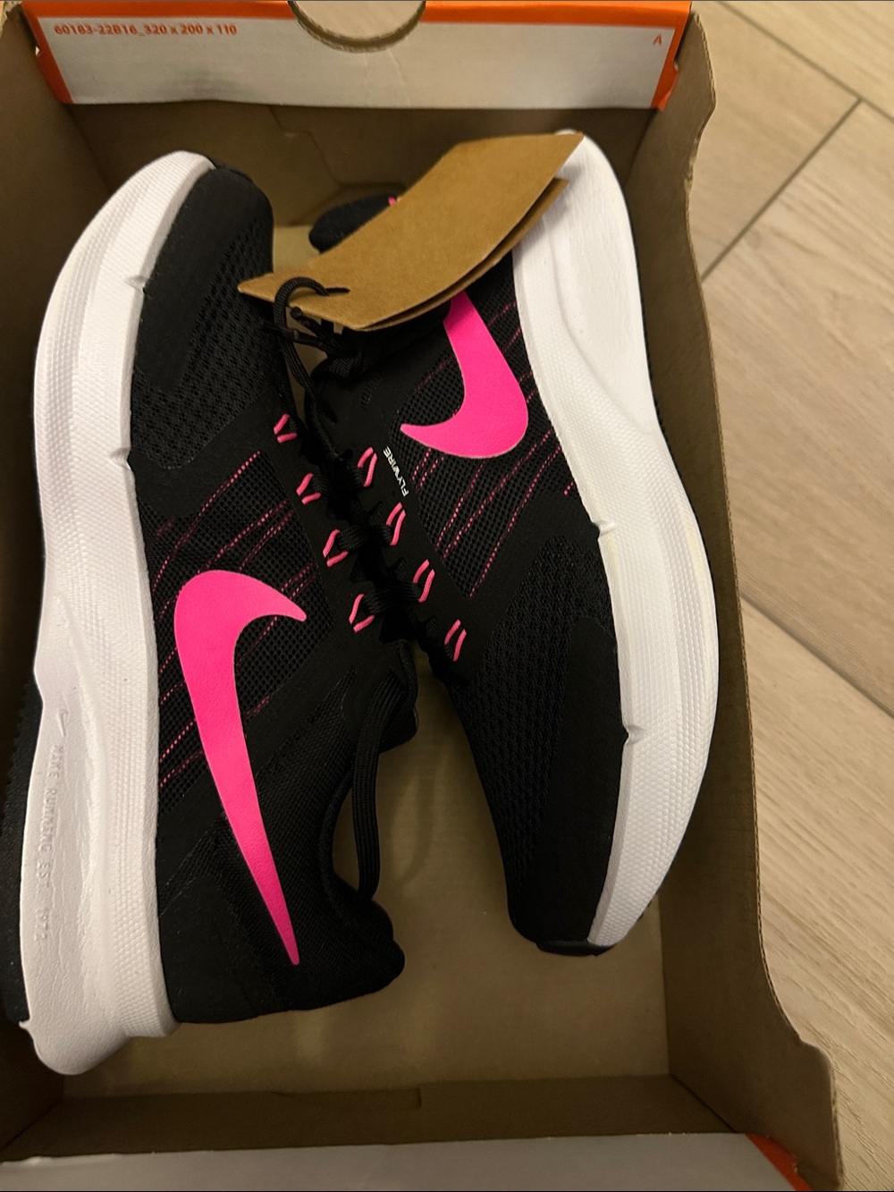 Nike Women's Black Sneakers with Hot Pink Swoosh